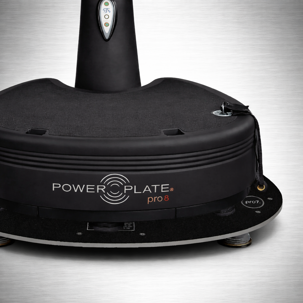 Close-up of Power Plate pro8 branding while mounted on Power Shield vibration reduction platform showing integrated system design and stable base support