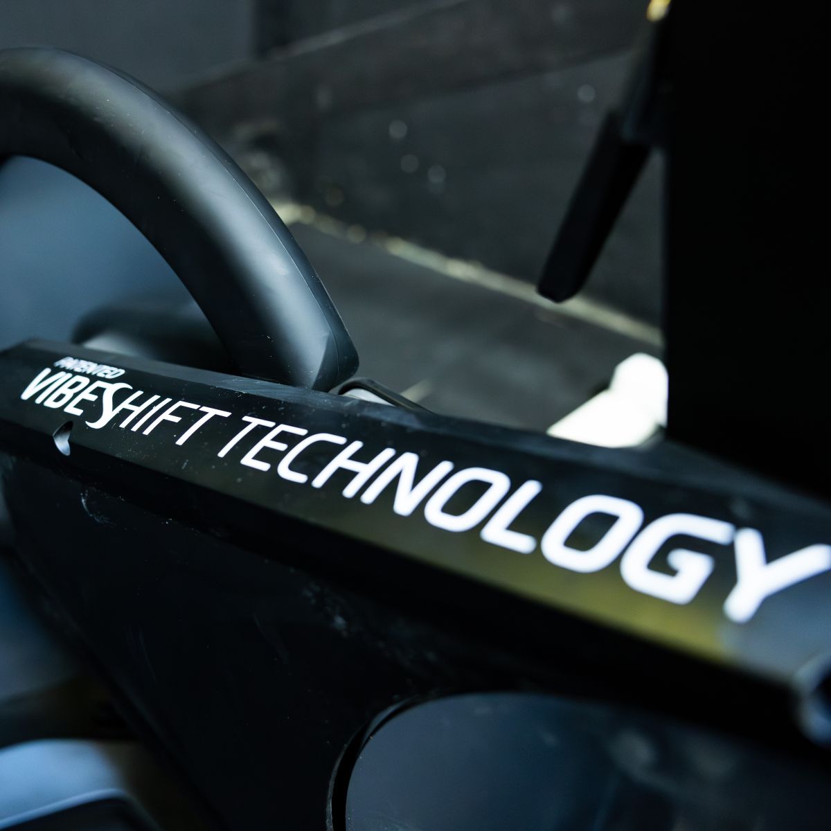 Close up of Power Plate REV bike frame showing patented VibeShift Technology branding