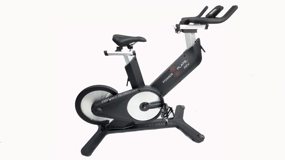 Power Plate REV bike vibration indoor cycle with VibeShift Technology black studio bike front profile