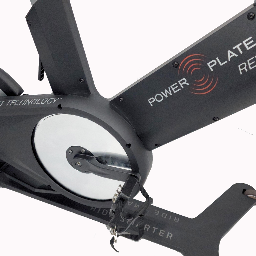 Power Plate REV bike vibration indoor cycle flywheel and pedal drivetrain detail