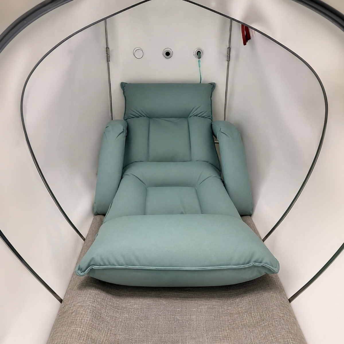 Prestige Hyperbaric chamber interior recliner seat and cushion showing user positioning comfort and enclosed treatment space