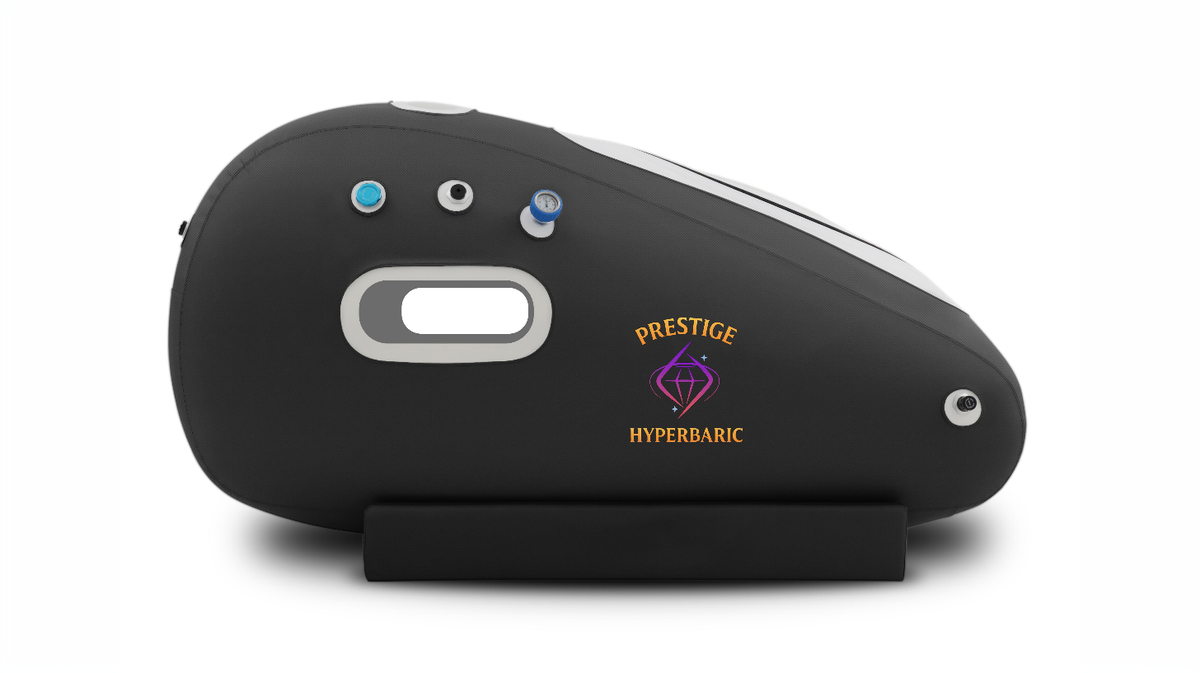 Prestige Hyperbaric softshell HBOT chamber side profile in studio environment showing pressure valves viewing window and exterior chamber design