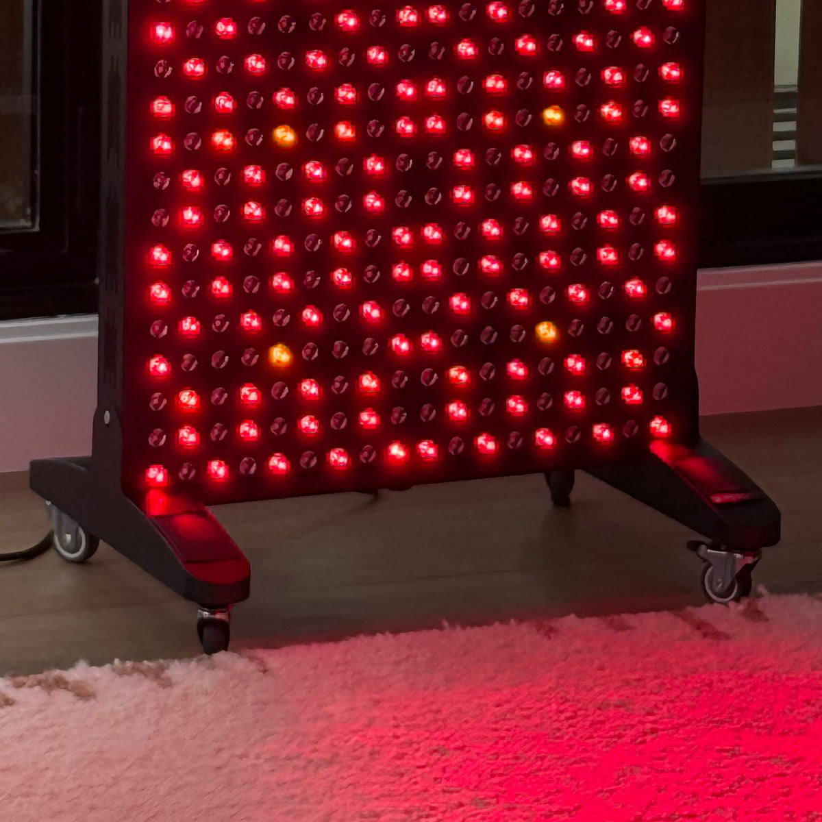 Renew Red Light Max Panel red light therapy panel base with rolling stand wheels on indoor floor surface