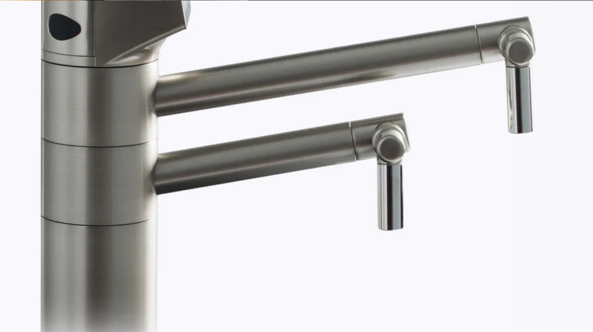 Tyent UCE-13 PLUS dual spout faucet showing separate alkaline and acidic water outlets in stainless steel finish